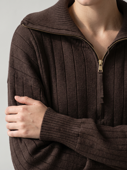 Close-up of chocolate brown ribbed knit sweatshirt funnel collar