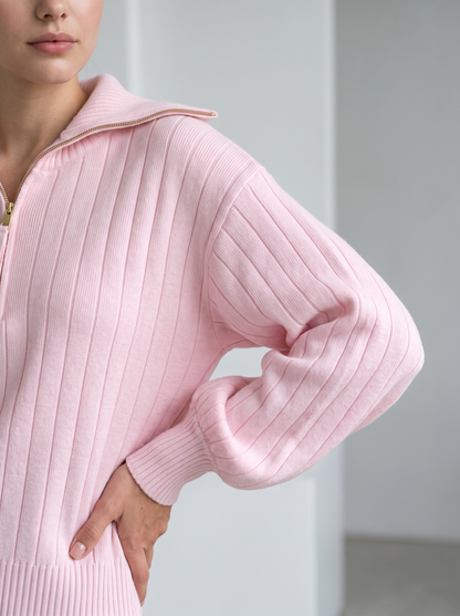 Detail of pink ribbed knit sweatshirt sleeve and side