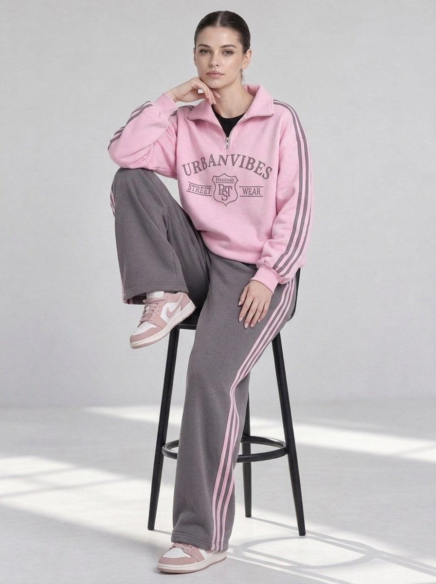Women's tracksuit "Urban" pink and gray - model sitting on a stool, side stripes on the trousers