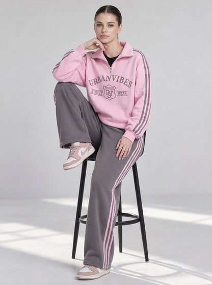 Women's tracksuit "Urban" pink and gray - model sitting on a stool, side stripes on the trousers